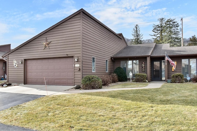 view of front of property with a garage and a front yard