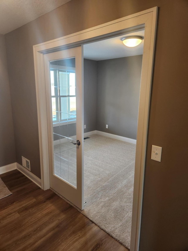 doorway to outside with dark hardwood / wood-style floors and french doors