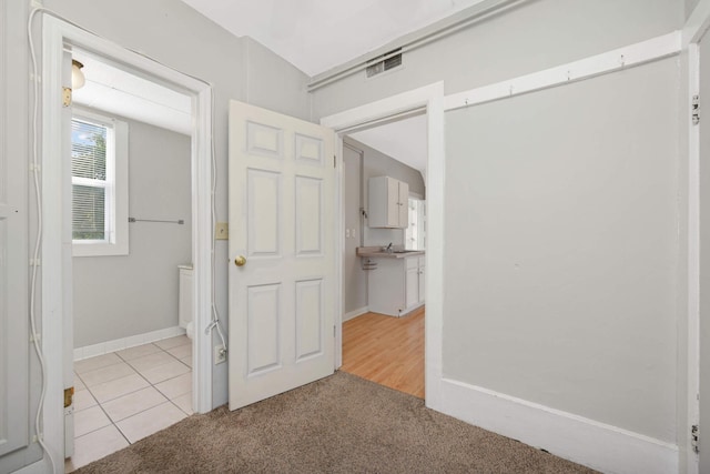 interior space featuring light colored carpet