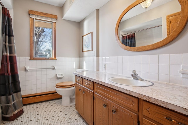 bathroom with tile patterned flooring, vanity, tile walls, and toilet