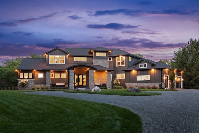 view of front facade featuring a yard and a garage