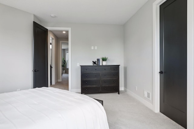 bedroom with light carpet