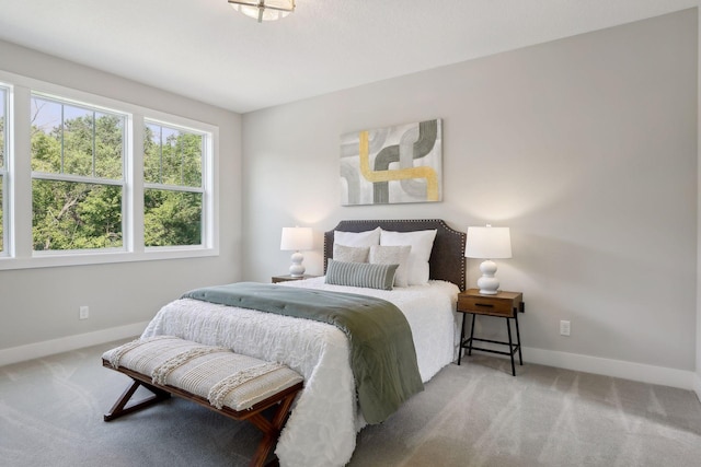 bedroom with light colored carpet