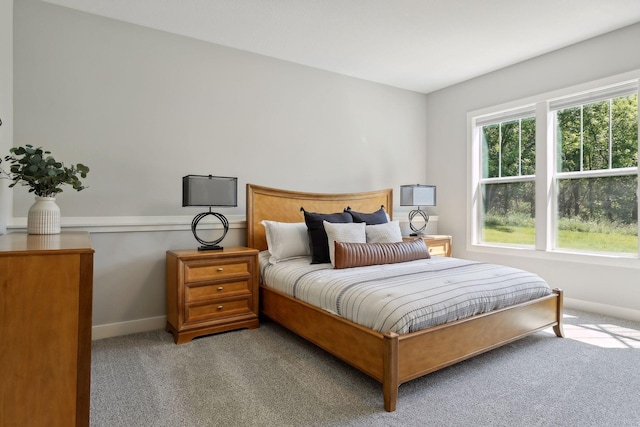 bedroom featuring light colored carpet