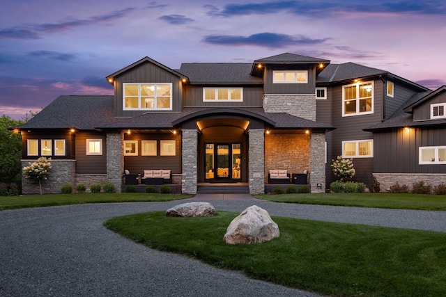9533 Otchipwe Ave N, Stillwater, MN 55082 - view of front of home featuring a lawn, roof with shingles, and stone siding