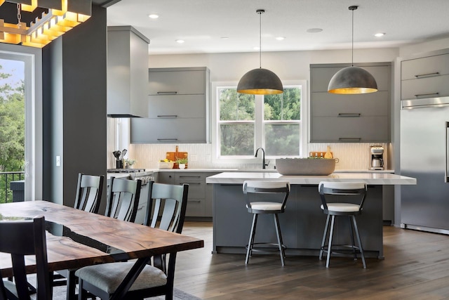 9533 Otchipwe Ave N, Stillwater, MN 55082 - kitchen featuring gray cabinetry, light countertops, modern cabinets, and stainless steel appliances