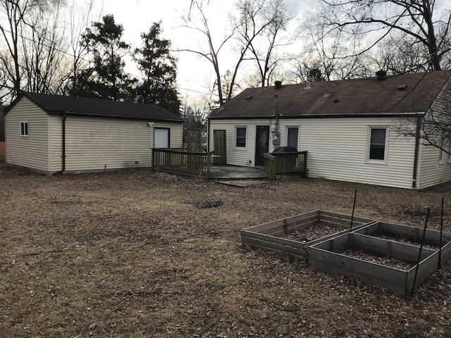 back of property featuring a wooden deck