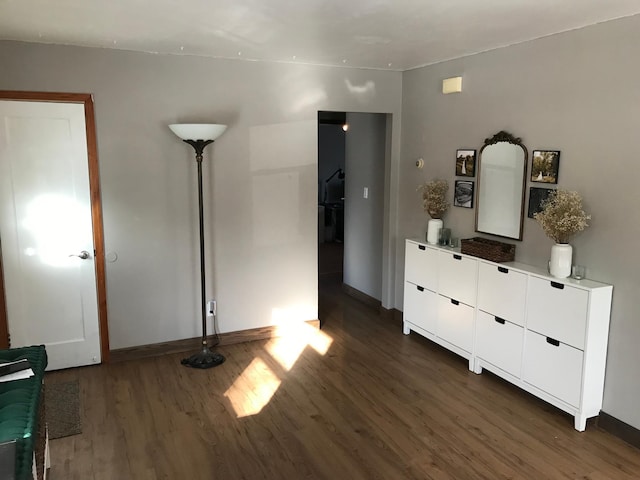 unfurnished bedroom featuring dark hardwood / wood-style floors