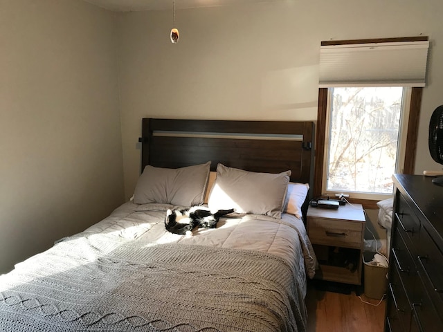 bedroom with wood-type flooring