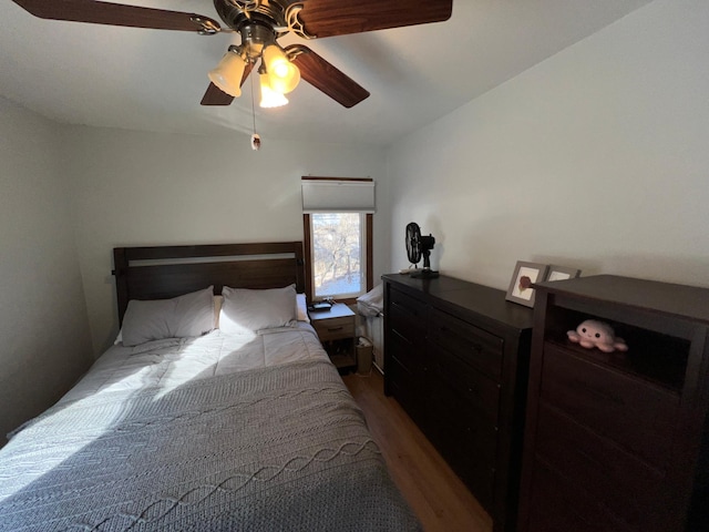 bedroom with ceiling fan and wood-type flooring