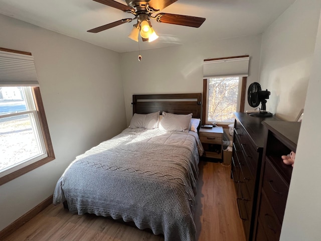 bedroom featuring hardwood / wood-style floors and ceiling fan