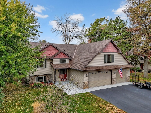 view of front of property with a garage