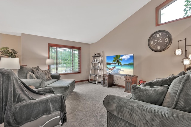 living room featuring light carpet, a wealth of natural light, and high vaulted ceiling