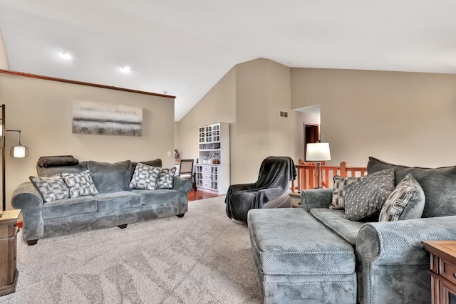 living room featuring lofted ceiling