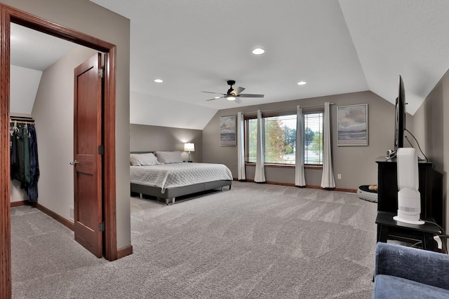 carpeted bedroom featuring ceiling fan and lofted ceiling