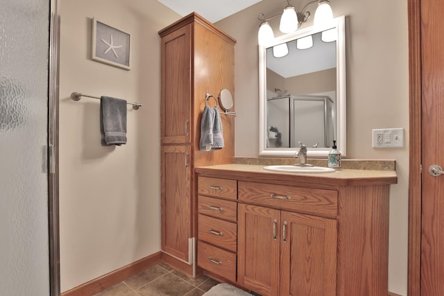 bathroom featuring vanity, tile patterned floors, and walk in shower