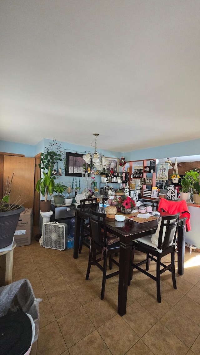 dining space featuring tile patterned floors