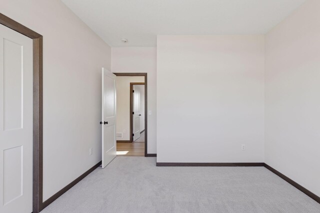 21933 Edison Ct, East Bethel, MN 55011 - unfurnished room featuring light colored carpet