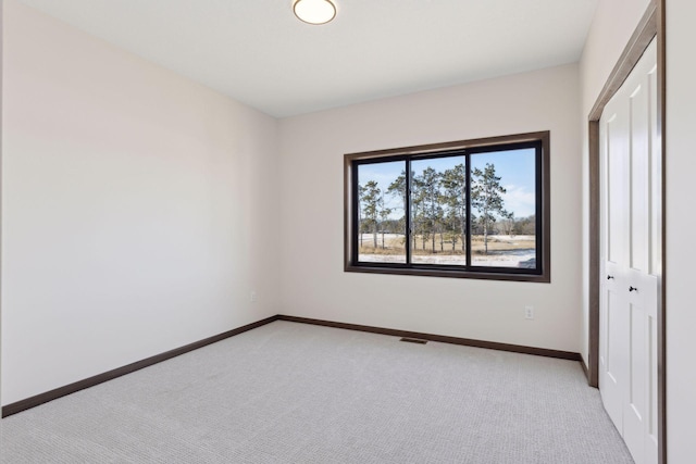 21933 Edison Ct, East Bethel, MN 55011 - unfurnished bedroom with light colored carpet and a closet