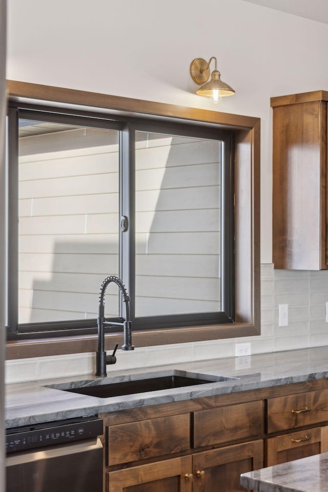 21933 Edison Ct, East Bethel, MN 55011 - kitchen featuring tasteful backsplash, dishwasher, and sink