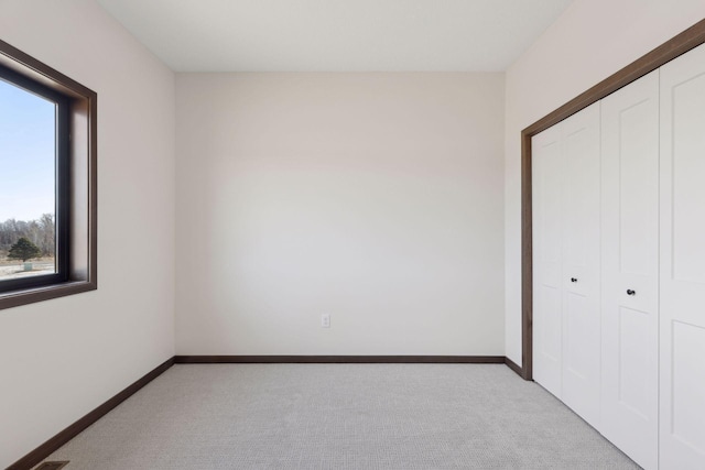21933 Edison Ct, East Bethel, MN 55011 - unfurnished bedroom with light colored carpet and a closet