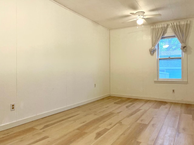 unfurnished room featuring ceiling fan and light wood-type flooring