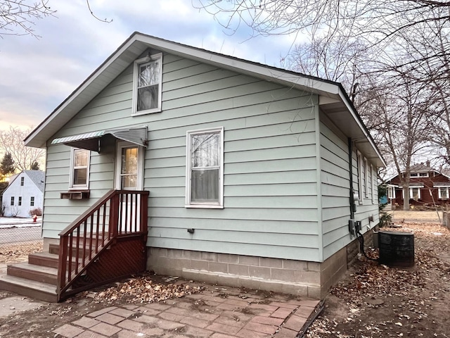 back of property with central AC unit