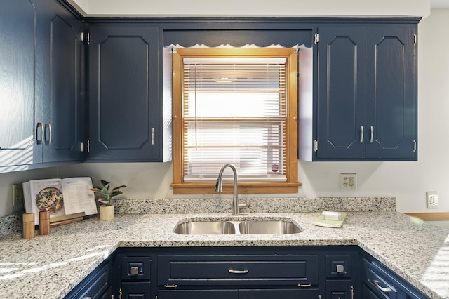 kitchen featuring sink and blue cabinets