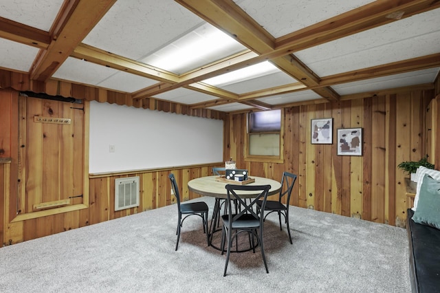 dining area with beamed ceiling, coffered ceiling, and wood walls