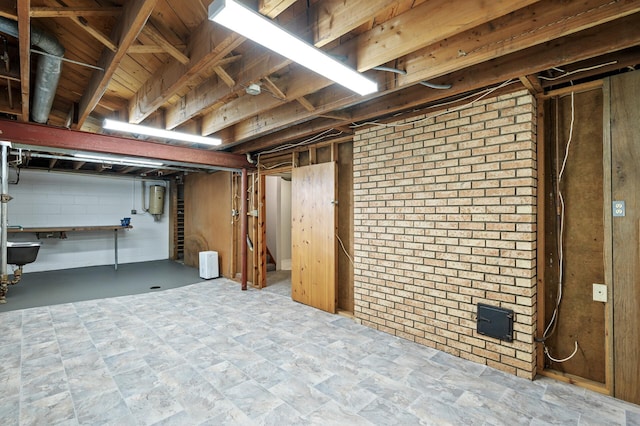 basement with brick wall