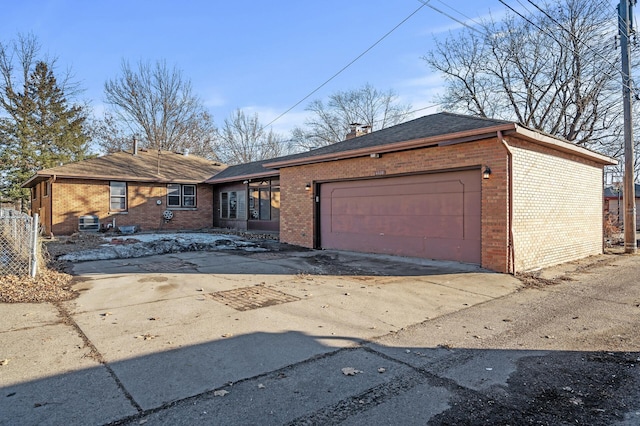 ranch-style home featuring a garage