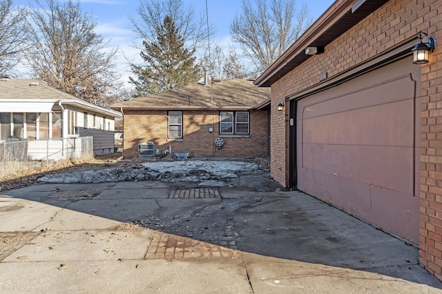 view of side of property with a garage