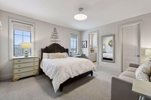 carpeted bedroom with ensuite bathroom