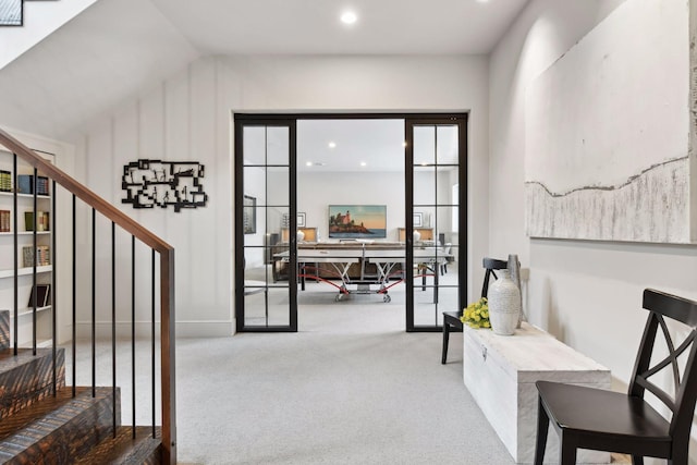 interior space featuring carpet floors and vaulted ceiling