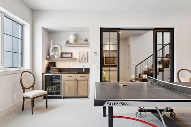 rec room featuring carpet flooring, indoor wet bar, and wine cooler