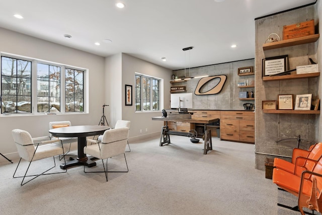 dining room featuring light carpet