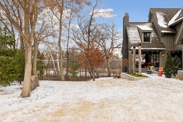 view of yard covered in snow