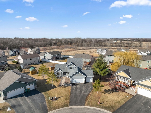 birds eye view of property with a residential view
