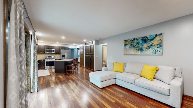 living room featuring dark wood-type flooring