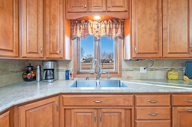 kitchen with sink and decorative backsplash