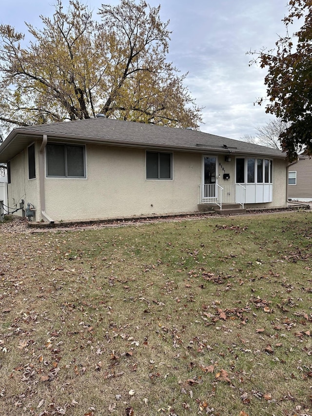 ranch-style house with a front yard