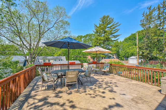 5524 Columbus Ave, Minneapolis, MN 55417 - wooden deck with outdoor dining area and a storage unit