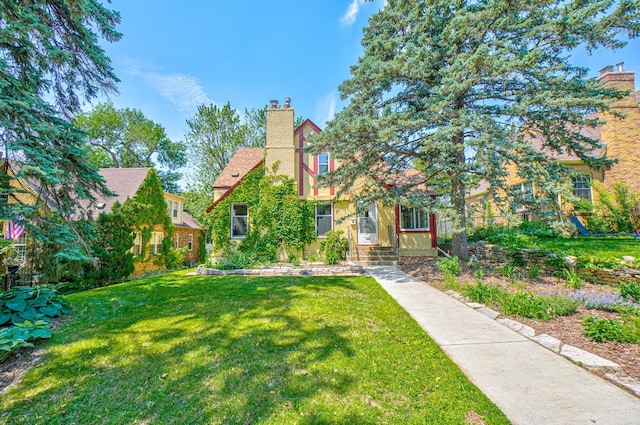 5524 Columbus Ave, Minneapolis, MN 55417 - view of front facade featuring a chimney and a front yard