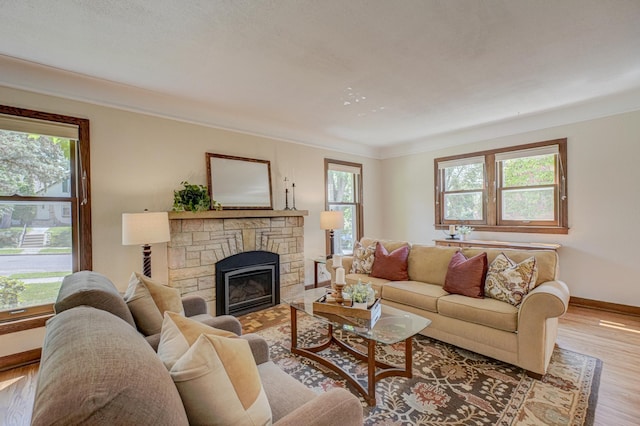 5524 Columbus Ave, Minneapolis, MN 55417 - living area with healthy amount of natural light, wood finished floors, a fireplace, and ornamental molding