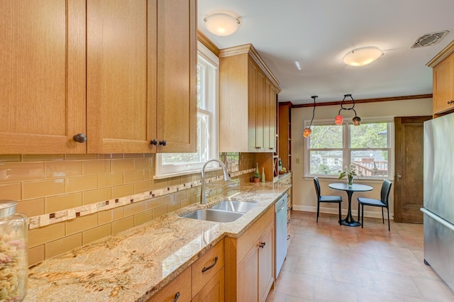 5524 Columbus Ave, Minneapolis, MN 55417 - kitchen with freestanding refrigerator, dishwashing machine, backsplash, and light stone counters