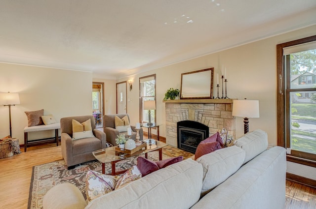 5524 Columbus Ave, Minneapolis, MN 55417 - living room featuring a fireplace, light wood-style floors, and ornamental molding