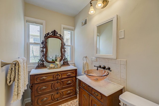 5524 Columbus Ave, Minneapolis, MN 55417 - bathroom featuring vanity and tasteful backsplash