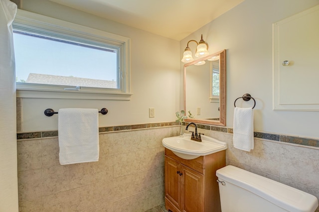 5524 Columbus Ave, Minneapolis, MN 55417 - half bathroom with tile walls, vanity, and wainscoting