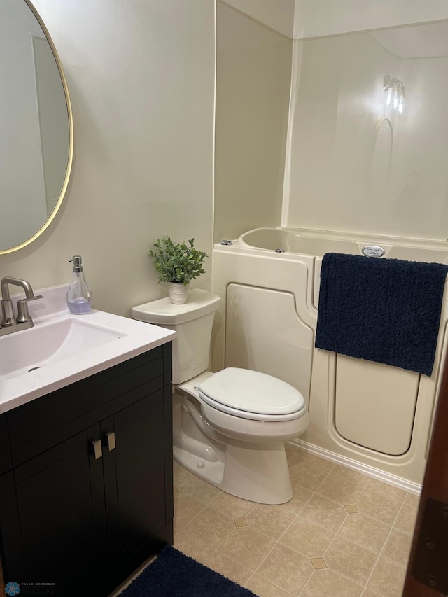 full bathroom with toilet, tile patterned flooring, a bath, and vanity