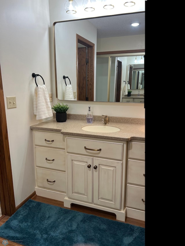 bathroom featuring vanity and baseboards